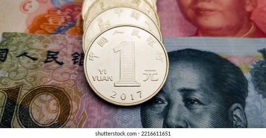 CNY. Several Coins On Chinese Banknotes. Chinese Money. Stack Of 1 Yuan Coins Close Up. Chinese Economy, Recession And Crisis