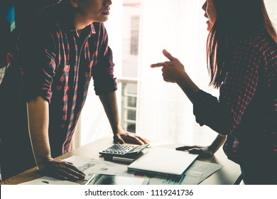 Co worker is argueing with friend over office table - Powered by Shutterstock