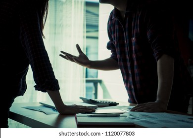 Co worker is argueing with friend over office table - Powered by Shutterstock