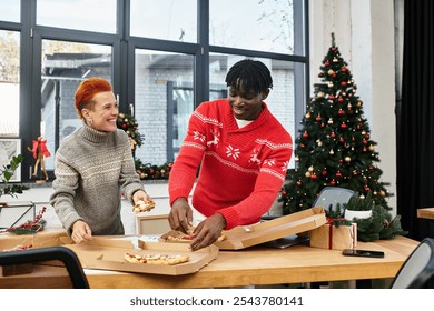 Co workers are sharing delicious food and laughter while celebrating the holiday season. - Powered by Shutterstock