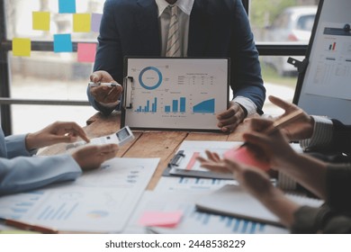 Co working conference, Business team meeting present, investor colleagues discussing new plan financial graph data on office table with laptop and digital tablet, Finance, accounting, investment.