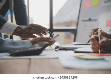 Co working conference, Business team meeting present, investor colleagues discussing new plan financial graph data on office table with laptop and digital tablet, Finance, accounting, investment.