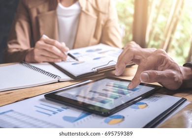 Co Working Conference, Business Team Meeting Present, Investor Colleagues Discussing New Plan Financial Graph Data On Office Table With Laptop And Digital Tablet, Finance, Accounting, Investment.