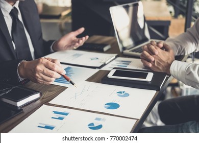 Co working conference, Business team meeting present, investor colleagues discussing new plan financial graph data on office table with laptop and digital tablet, Finance, accounting, investment. - Shutterstock ID 770002474