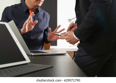 co working team meeting concept,businessman using smartphone and digital tablet and laptop computer in modern office - Shutterstock ID 629071790