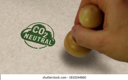 CO2 Carbon Neutral Emission Stamp And Stamping Hand. Ecology, Nature Friendly, Climate Change, Green Fuel And Earth Protect Concept.