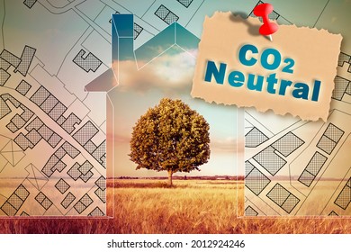 CO2 Neutral In Construction Industry And Building Activity With Home Against A Natural Landscape And Imaginary City Map
