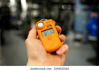 Co2 Safety Personal Portable Gas Monitor And Detector In Heavy Indrustry Worker's Hand