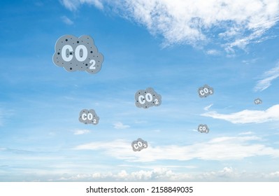 CO2 Symbol On Blue Sky And White Clouds. CO2 Emissions. Greenhouse Gas. Carbon Dioxide Gas Global Air Climate Pollution. Environment Issue. Background For Carbon Capture And Storage Technology.