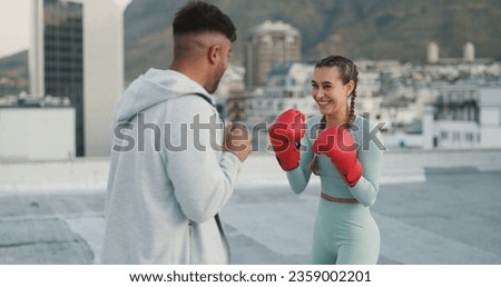 Coach, boxing and woman outdoor for training on rooftop in a city. Couple of friends, happy athlete and boxer gloves with personal trainer man for martial arts workout, exercise and fight for sports