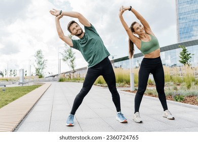 Coach and client. Together athletes workout fitness. A woman and a man running around in sports clothes. Friends use running shoes. A young family is engaged in sports for health. - Powered by Shutterstock