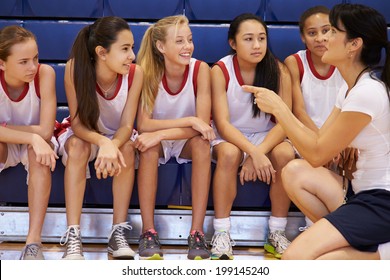 Coach Of Female High School Basketball Team Gives Team Talk - Powered by Shutterstock