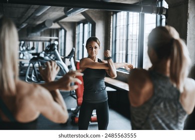 Coach, group and arm fitness in gym for self defense, exercise or muscle workout with strength training. Personal trainer, collaboration or warm up for healthy body challenge, performance or wellness - Powered by Shutterstock