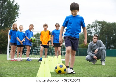 Coach Leading Outdoor Soccer Training Session - Powered by Shutterstock