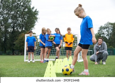 Coach Leading Outdoor Soccer Training Session - Powered by Shutterstock