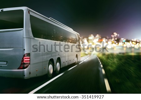 Coach on a coutry road at night