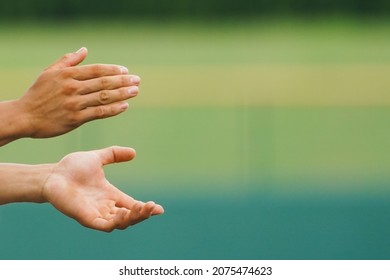 A Coach On Hand To Inspire Players With Applause During A Baseball Game.