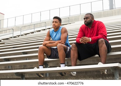 Coach Spending Time Mentoring A Student Athlete.