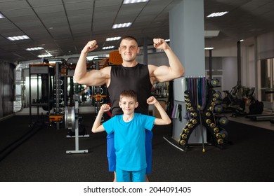 Coach and student in gym, training for children of school. Active sports healthy lifestyle, concept. A man and a boy pose, smile, are happy. Physical activity for schoolchildren, treatment of problems - Powered by Shutterstock