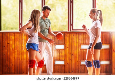 Coach and students in training volleyball - Powered by Shutterstock