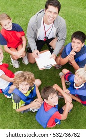 Coach Talking To Childrens Soccer Team