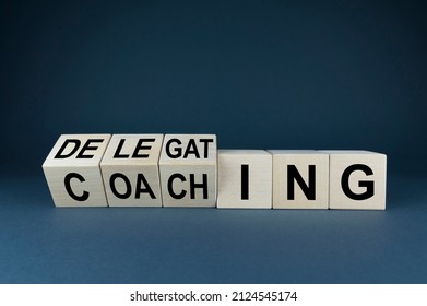 Coaching or Delegating Cubes form the words delegation or coaching. Concept coaching or Delegating in business