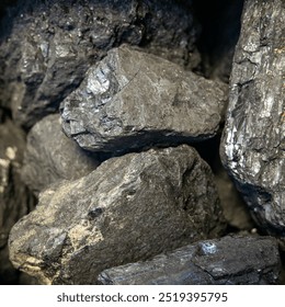 Coal in close-up. solid fuel is a useful fossil fuel for heating housing. Environmental concept, air pollution, coal energy