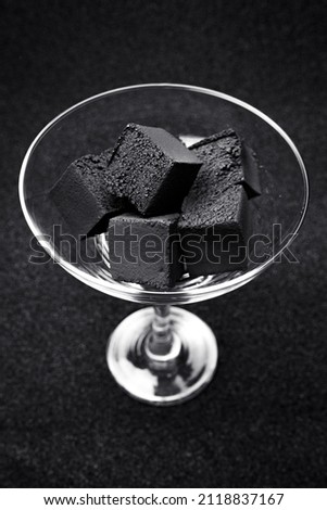 Coal for hookah. Coal for a hookah on a gray background.