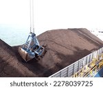 Coal loading on the barge using Grab Ship Unloader