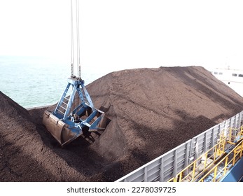 Coal loading on the barge using Grab Ship Unloader