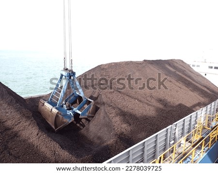 Coal loading on the barge using Grab Ship Unloader