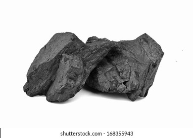 Coal lumps spilled on white background