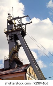 Coal mine headgear tower on blue sky