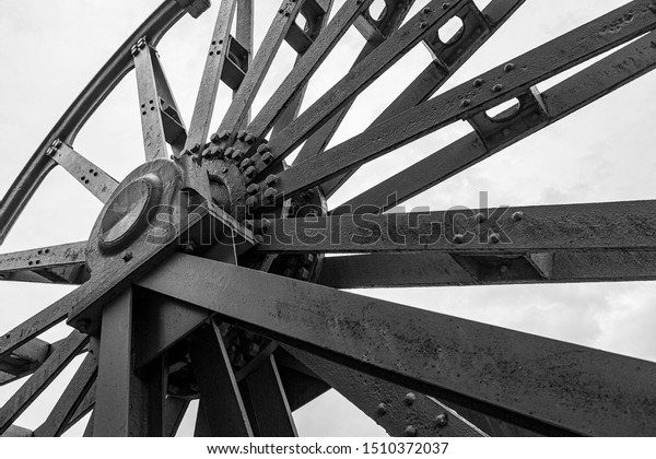 coal mine shaft\
tower wheel detail\
greyscale