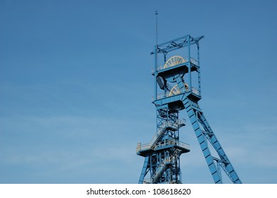 Coal Mine. Tower On Blue Sky.