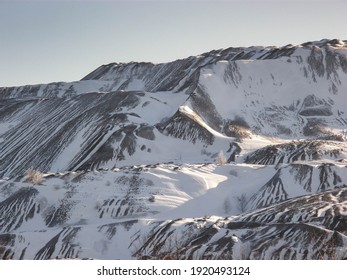 A Coal Mine Waste Heap, Slag Heap Covered With Snow, A Mountain Covered With Snow In Cold Winter, Cold Landscape Of The Mountain