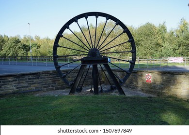 Coal mine winding head wheel at the entrance to the national coal minning museum for england Wakefield Yorkshire England 17/09/2019 by Roy Hinchliffe
