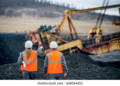 Coal mine workers in an open pit
