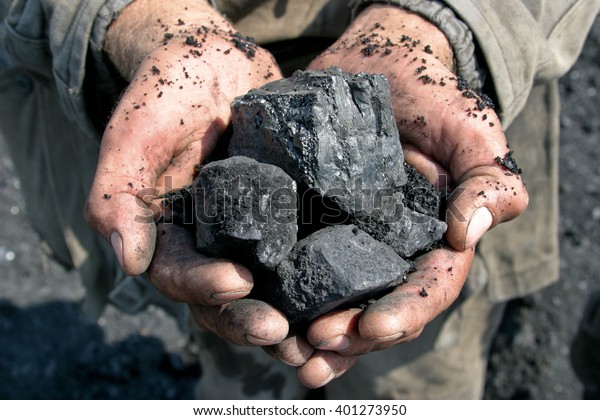 coal miner in the hands\
of