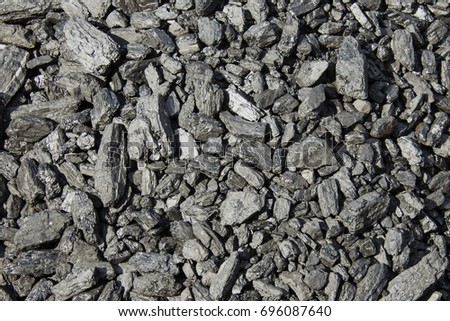 Coal mineral black cube stone background. textured