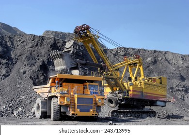 Coal Mining. The Dredge Loads The Truck Coal.