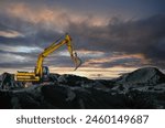 Coal mining in an open-pit. Excavator on Coal mining. Excavator digging in open pit coal mine. Excavator in open-pit on sunset background. Heavy machinery in opencast. Earthmover on earthmoving