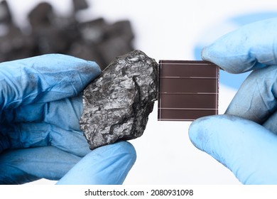 Coal Next To Solar Paner In Scientist Hands In Laboratory. Green Energy Transition Research.