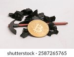 coal with pickaxe and bitcoin coin