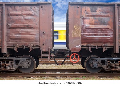 Coal railroad cars and speed train in motion