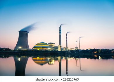 coal-fired power plant in nightfall , industrial landscape  