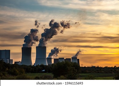 a coal-fired power station at sunset