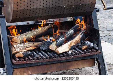 Coals And Firewood On Fire, For Cooking Chestnuts In An Italian Street Festival