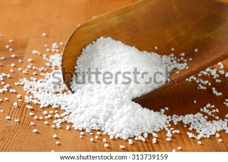 Coarse grained salt on a wooden scoop Stock photo © 