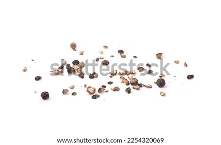 Coarsely crushed black pepper isolated on a white background .